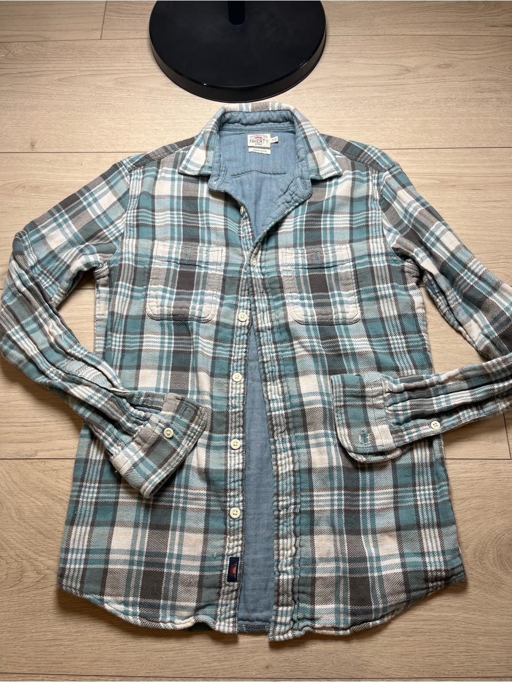 The Faherty flannel plaid shirt in sage, beige, and brown is a stylish and vers